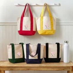Floral Mini Tote Bag .product-info-decoration { display: inline-flex; justify-content: space-between; align-items: center; border-radius: 0.4rem; background-color: #E8E8E8; padding: 0.2rem 0.4rem; font-size: 1.4rem; line-height: 1.6rem; font-weight: var(--font-weight-semibold); letter-spacing: 0.042rem; text-transform: uppercase; --decoration-icon-url: ''; /* will be dynamically set */}.product-info-decoration.badge-icon::before { content: ''; width: 2rem; height: 2rem; background: var(--decoration-icon-url) no-repeat; background-size: 100% 100%; display: block; margin-right: 0.4rem;} FULL-COLOR CUSTOMIZATION