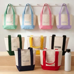 Name Mini Tote Bag .product-info-decoration { display: inline-flex; justify-content: space-between; align-items: center; border-radius: 0.4rem; background-color: #E8E8E8; padding: 0.2rem 0.4rem; font-size: 1.4rem; line-height: 1.6rem; font-weight: var(--font-weight-semibold); letter-spacing: 0.042rem; text-transform: uppercase; --decoration-icon-url: ''; /* will be dynamically set */}.product-info-decoration.badge-icon::before { content: ''; width: 2rem; height: 2rem; background: var(--decoration-icon-url) no-repeat; background-size: 100% 100%; display: block; margin-right: 0.4rem;} FULL-COLOR CUSTOMIZATION